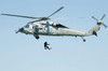 A diver is lowered from an SH-60B Seahawk helicopter Poster Print by Stocktrek Images - Item # VARPSTSTK107046M