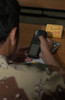 An Iraqi Army lieutenant learns how to use a handheld GPS device Poster Print by Stocktrek Images - Item # VARPSTSTK104452M