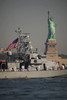 Fleet week vessels pass by the Statue of Liberty Poster Print by Stocktrek Images - Item # VARPSTSTK104628M