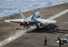 A US Navy F/A-18C Hornet launches from the flight deck of USS Nimitz Poster Print by Stocktrek Images - Item # VARPSTSTK108439M