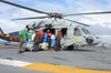 Sailors load fresh water onto an MH-60S Seahawk Poster Print by Stocktrek Images - Item # VARPSTSTK108113M
