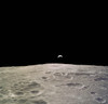 Partially Illuminated Earth Rises Above the Lunar Horizon Poster Print by Stocktrek Images - Item # VARPSTSTK200218S
