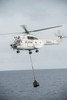 An SA-330 Puma transport helicopter moves cargo during a vertical replenishment Poster Print by Stocktrek Images - Item # VARPSTSTK107829M