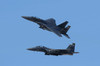 A pair of F-15C Eagle aircraft perform maneuvers at an airshow Poster Print by Remo Guidi/Stocktrek Images - Item # VARPSTRGU100021M