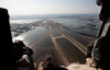 Airmen fly over the Sendai Airport in Japan to survey the tsunami aftermath Poster Print by Stocktrek Images - Item # VARPSTSTK104182M