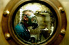 US Navy Damage Controlman is sprayed with salt water in one of the decontamination shower rooms Poster Print by Stocktrek Images - Item # VARPSTSTK100074M