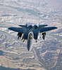 An F-15E Strike Eagle soars over the mountains of Afghanistan Poster Print by Stocktrek Images - Item # VARPSTSTK101398M