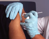 Nurse administers a vaccine into a patient's arm Poster Print by National Institutes of Health/Stocktrek Images - Item # VARPSTNIH700042H