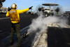 Aviation Boatswain's Mate directs an E-2C Hawkeye on the flight deck Poster Print by Stocktrek Images - Item # VARPSTSTK106941M