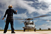 Airman signals the pilot of an MH-60S Seahawk to start the engine Poster Print by Stocktrek Images - Item # VARPSTSTK101207M