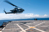 An AH-1W Super Cobra helicopter lands aboard USS Denver Poster Print by Stocktrek Images - Item # VARPSTSTK105785M