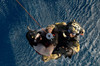 A pararescueman and rescuee are hoisted into an HH-60G Pave Hawk Poster Print by Stocktrek Images - Item # VARPSTSTK108271M
