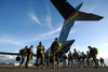 Soldiers prepare to board a C-17 Globemaster III Poster Print by Stocktrek Images - Item # VARPSTSTK102671M