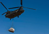 A US Army CH-47 Chinook carries a bulldozer to a drop site Poster Print by Stocktrek Images - Item # VARPSTSTK106582M