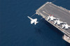 An F/A-18 Hornet flys over aircraft carrier USS Enterprise Poster Print by Stocktrek Images - Item # VARPSTSTK100511M