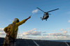 Boatswain??s Mate signals to a French Armee De Terre SA 380 Puma helicopter Poster Print by Stocktrek Images - Item # VARPSTSTK107678M