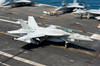 An F/A-18E Super Hornet hooks an arresting gear wire while landing Poster Print by Stocktrek Images - Item # VARPSTSTK106470M