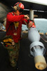 Aviation Ordnanceman attaches a stabilizer fin to a GBU-16 1000 pound laser-guided bomb Poster Print by Stocktrek Images - Item # VARPSTSTK100685M