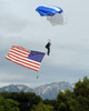 Airman floats through the sky carrying the American flag Poster Print by Stocktrek Images - Item # VARPSTSTK103003M