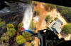 The Bambi Bucket attached to a CH-47 Chinook helicopter, dumps water on a wildfire in Texas Poster Print by Stocktrek Images - Item # VARPSTSTK105104M