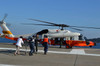Personnel transport a simulated victim to a helicopter during a casualty drill Poster Print by Stocktrek Images - Item # VARPSTSTK106686M