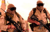 Airmen guard an entry control point during a sandstorm Poster Print by Stocktrek Images - Item # VARPSTSTK101087M