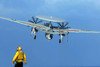 A flight deck director watches an E-2C Hawkeye taking off Poster Print by Stocktrek Images - Item # VARPSTSTK102117M
