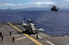 A CH-53D Sea Stallion sits on the flight deck as another prepares to land aboard USS Bonhomme Richard Poster Print by Stocktrek Images - Item # VARPSTSTK103769M