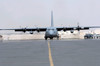 Ground crews prepare a C-130 Hercules for take off Poster Print by Stocktrek Images - Item # VARPSTSTK102435M