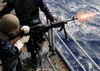 US Navy Airman fires an M-240B machine gun aboard USS Essex Poster Print by Stocktrek Images - Item # VARPSTSTK104014M