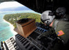 Airmen push out a pallet of donated goods over the Island of Yap from a C-130 Hercules Poster Print by Stocktrek Images - Item # VARPSTSTK102850M