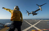 Aviation Boatswain's Mate directs an MV-22 Osprey as it launches from the flight deck Poster Print by Stocktrek Images - Item # VARPSTSTK107526M