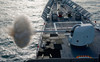 USS Cape St George fires its MK-45 lightweight 5-inch gun Poster Print by Stocktrek Images - Item # VARPSTSTK105615M