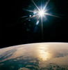 Glowing Star Over Earth Poster Print by Stocktrek Images - Item # VARPSTSTK200812S