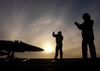 ailors give taxi signals to an F/A-18 Hornet prior to launching Poster Print by Stocktrek Images - Item # VARPSTSTK100834M