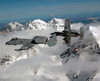 A-10 Thunderbolt II's fly over mountainous landscape Poster Print by Stocktrek Images - Item # VARPSTSTK102354M