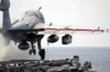 Airman ducks down as an EA-6B Prowler launches from the flight deck aboard USS Ronald Reagan Poster Print by Stocktrek Images - Item # VARPSTSTK100468M