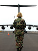 An airfield manager greets an arriving C-17 Globemaster III Poster Print by Stocktrek Images - Item # VARPSTSTK102666M