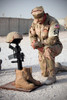 A soldier bows to pay tribute to a fallen soldier Poster Print by Stocktrek Images - Item # VARPSTSTK102716M