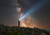 Man shining a flashlight on the Milky Way from Lago-Naki plateau in Russia Poster Print by Yuri Zvezdny/Stocktrek Images - Item # VARPSTYZV200030S