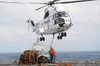 Sailors hook up a pole pendant to a SA-330J Puma helicopter Poster Print by Stocktrek Images - Item # VARPSTSTK105726M