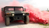 Red smoke billows out onto a humvee Poster Print by Stocktrek Images - Item # VARPSTSTK102729M
