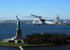 An MH-60S Knighthawk flies near the Statue of Liberty Poster Print by Stocktrek Images - Item # VARPSTSTK100650M