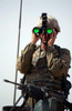 US Army Specialist uses binoculars to scan the perimeter Poster Print by Stocktrek Images - Item # VARPSTSTK101426M