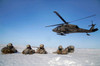 US Army paratroopers pull security after exiting a UH-60 Black Hawk Poster Print by Stocktrek Images - Item # VARPSTSTK108634M