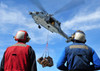 Flight deck personnel wait for supplies from an MH-60S Sea Hawk Poster Print by Stocktrek Images - Item # VARPSTSTK105606M