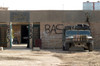 A M998 humvee parked outside an abandoned school Poster Print by Stocktrek Images - Item # VARPSTSTK106108M