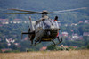 A Swiss Air Force EC-635 helicopter landing in a field Poster Print by Timm Ziegenthaler/Stocktrek Images - Item # VARPSTTZG100586M