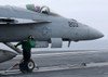 An aviation boatswain's mate prepares an F/A-18E Super Hornet to launch Poster Print by Stocktrek Images - Item # VARPSTSTK106457M