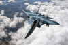 An F-15C Aggressor flies over a mountain range Poster Print by Stocktrek Images - Item # VARPSTSTK102557M